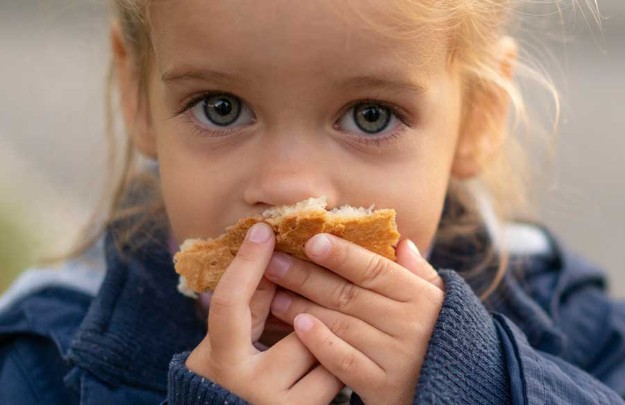 RFB Home Page Girl Eating Bread